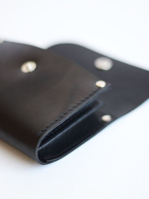 4. Close-up of black FRIDAY Wallet by TOKS VISOKS highlighting recycled leather material and stitching details