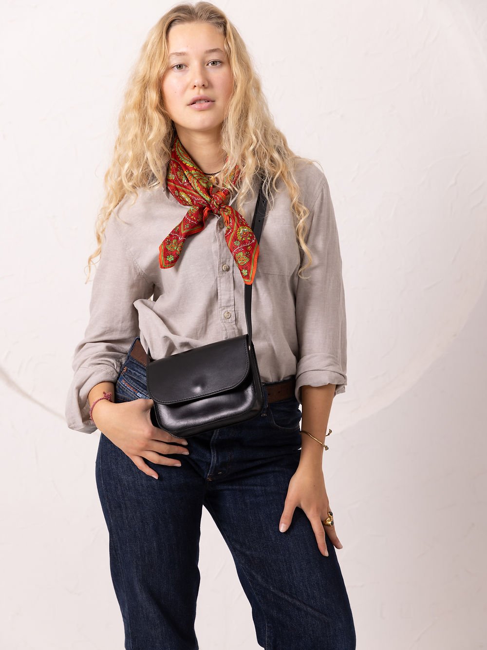 13. Women's black RUBY Purse by TOKS VISOKS worn crossbody, shown in full outfit