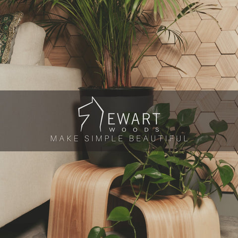 1. Wooden plant stand with green plants in a modern living room setting, featuring hexagonal wall pattern and sofa