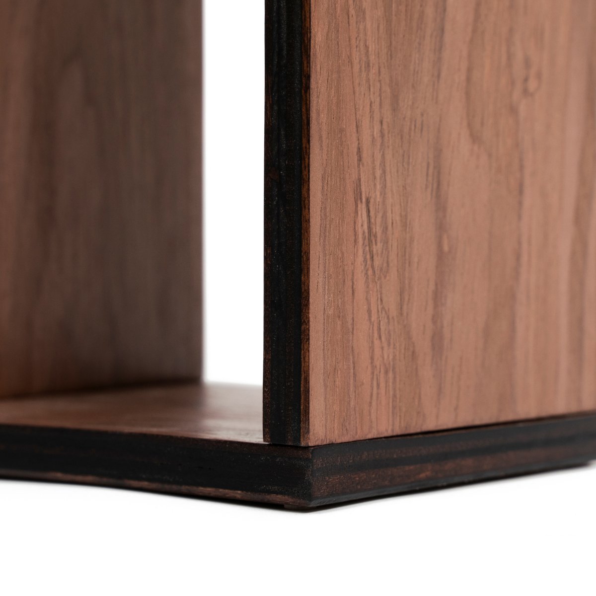 3. Detail of handcrafted birch plywood base of toilet paper holder, showing wood grain