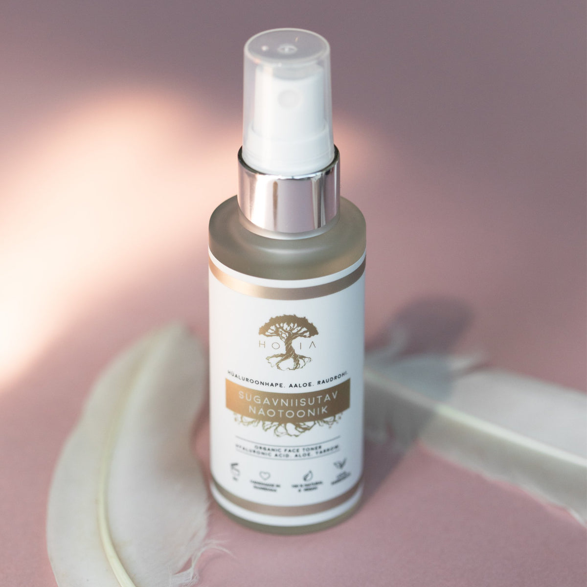 1. HOIA homespa deep moisturizing face toner in 50ml glass bottle with sprayer, shown on pink background with feather