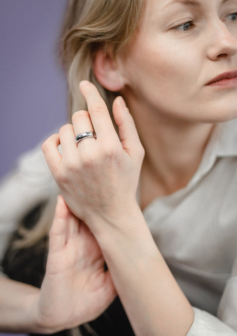 1. Woman wearing Maarja Palu's Ring HOLLOW in silver, showcasing minimalist design