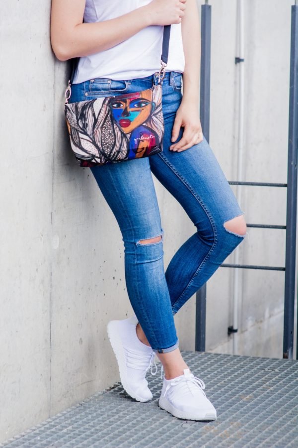 1. Women's shoulder bag with mermaid artwork by Dovilė Aleksonė, worn crossbody with jeans and white sneakers