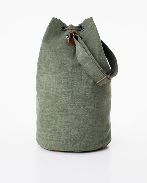 3. Studio image of Trendbag Märss upcycled bag in light green, showing front view with drawstring closure