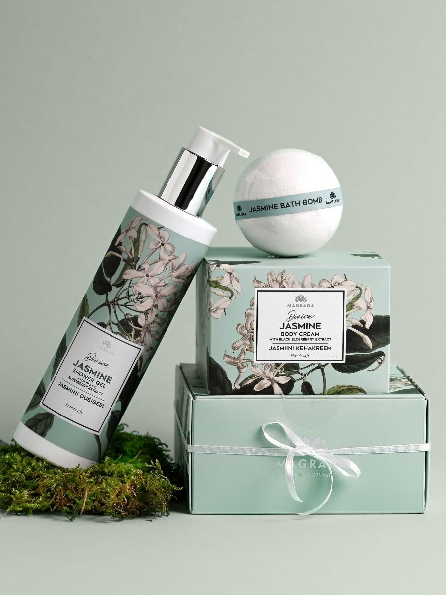 3. Magrada Organic Cosmetics Jasmine Body Cream, shower gel, and bath bomb set on a green background, emphasizing product range