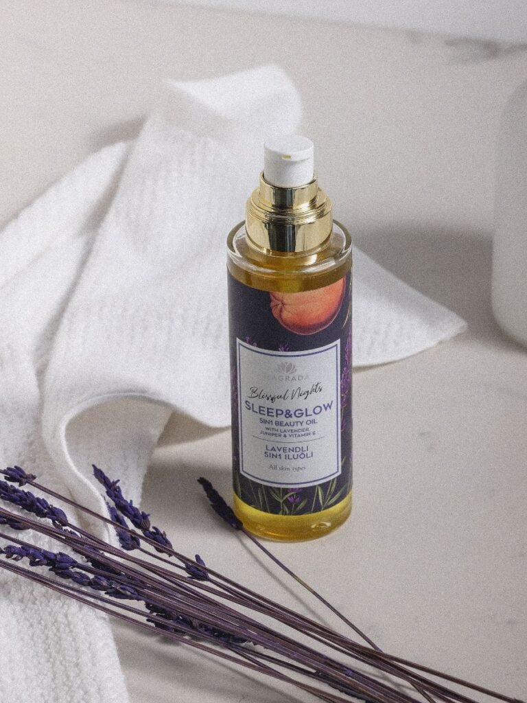 3. Magrada Organic Cosmetics Lavender Body Oil with Vitamin E on white surface with lavender sprigs, lifestyle setting