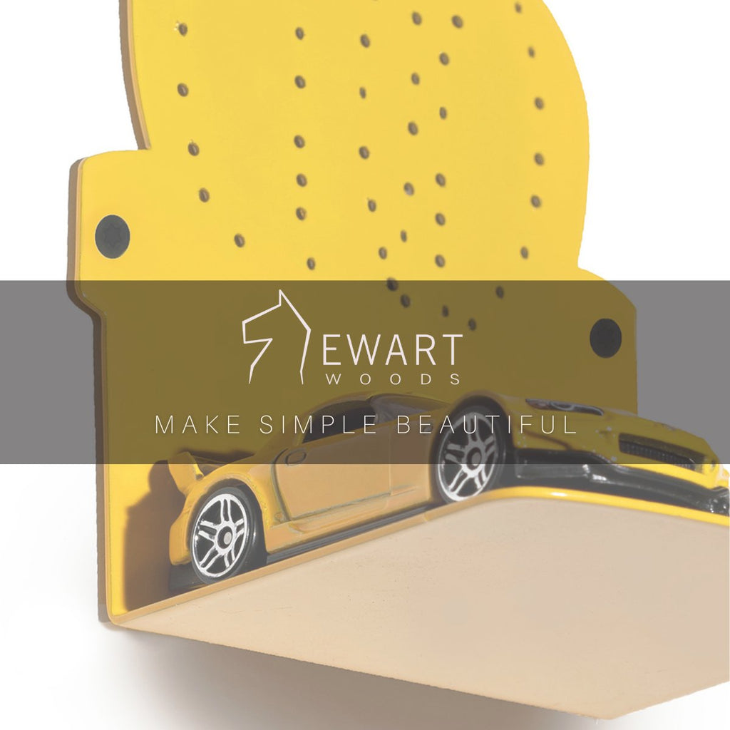 6. Close-up of yellow cactus-shaped hanger with Ewart Woods logo and toy car on shelf