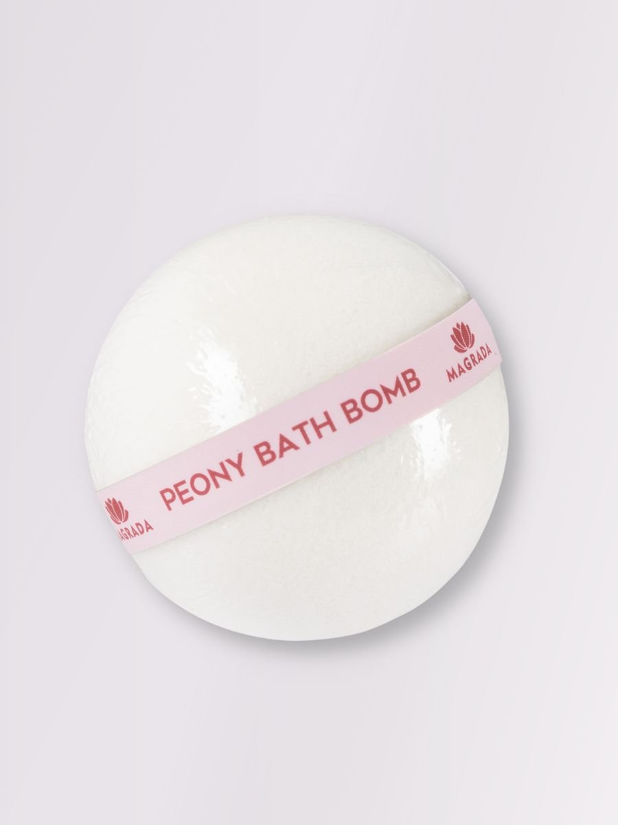 3. Close-up of Magrada Peony Bath Bomb with pink label, highlighting smooth texture and branding
