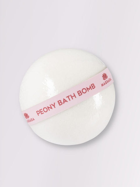 3. Close-up of Magrada Peony Bath Bomb with pink label, highlighting smooth texture and branding