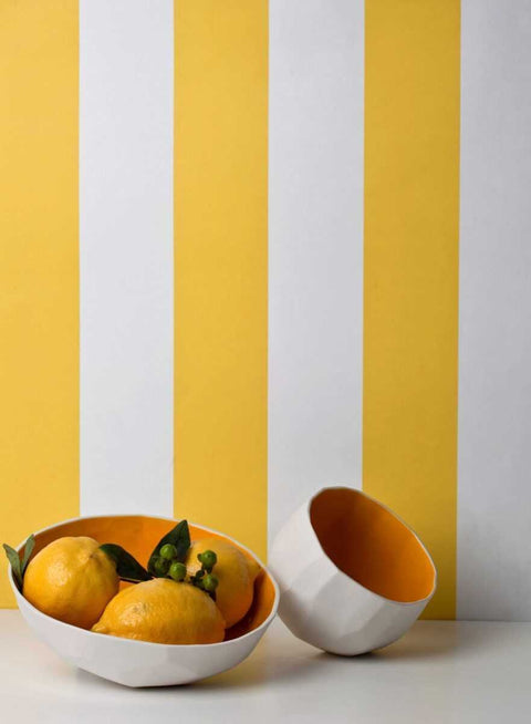 2. Yellow and white striped eco wallpaper by Miurio with lemons in a white bowl