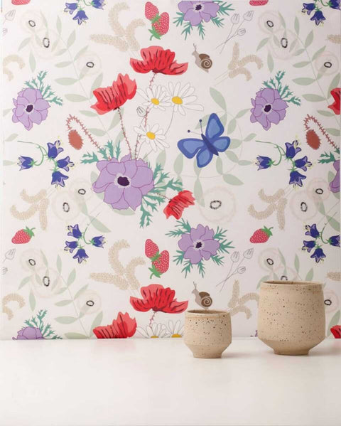 1. Vanilla Meadow eco wallpaper with floral and butterfly pattern in a room setting with beige ceramic vases