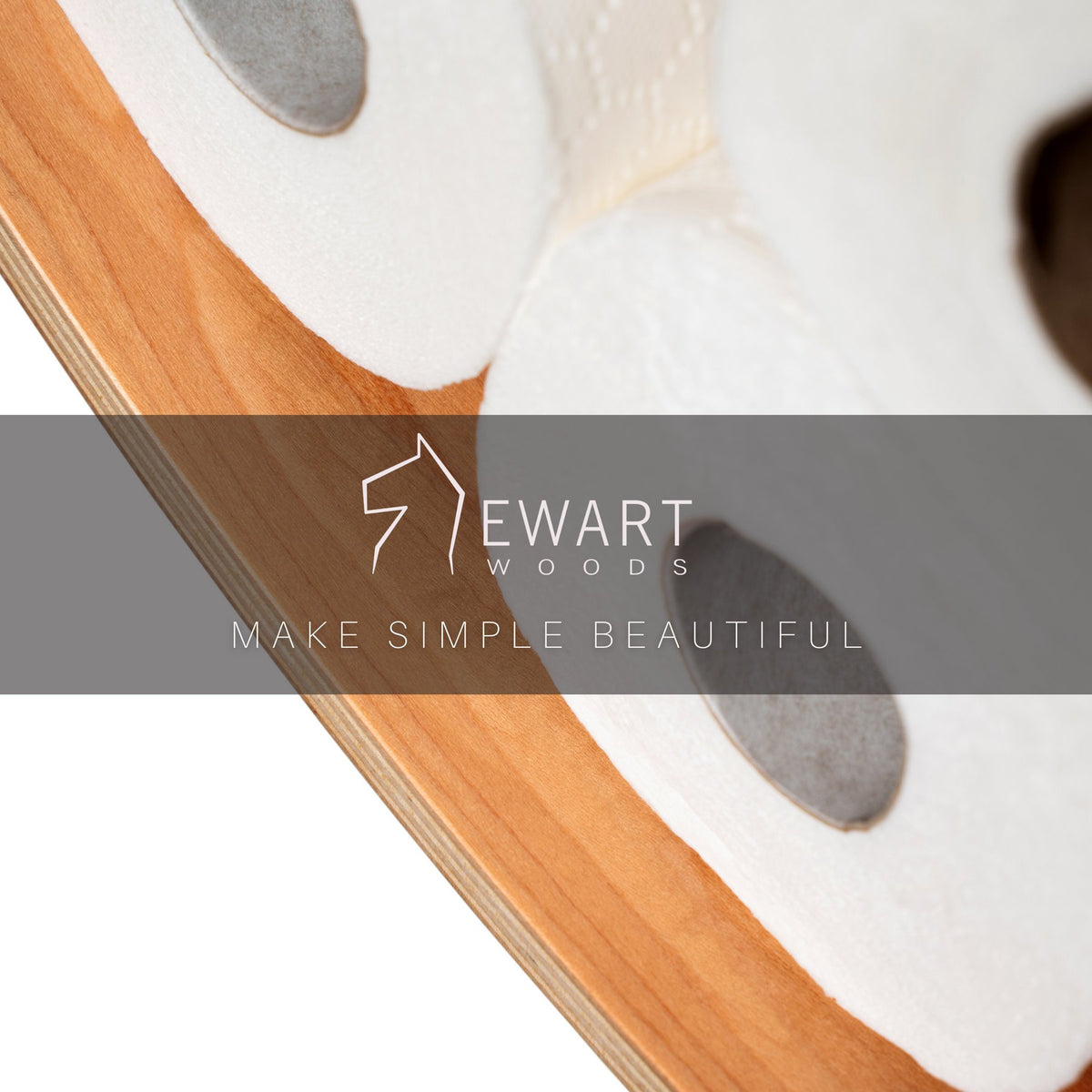 3. Close-up of Ewart Woods logo and slogan 'Make Simple Beautiful' on wooden toilet paper holder with rolls