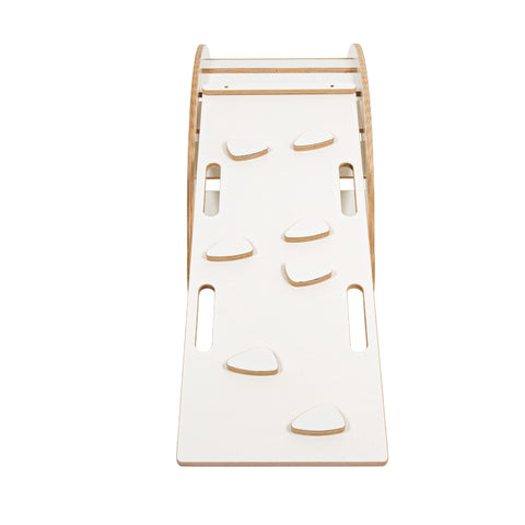 2. White slide with climbing holds attached to wooden dream rocker