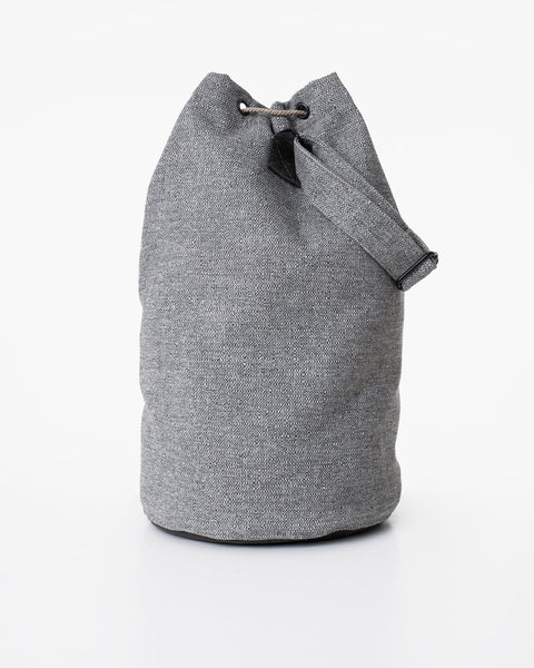 3. Studio shot of Trendbag Märss upcycled bag in light grey, showcasing drawstring closure and faux leather details