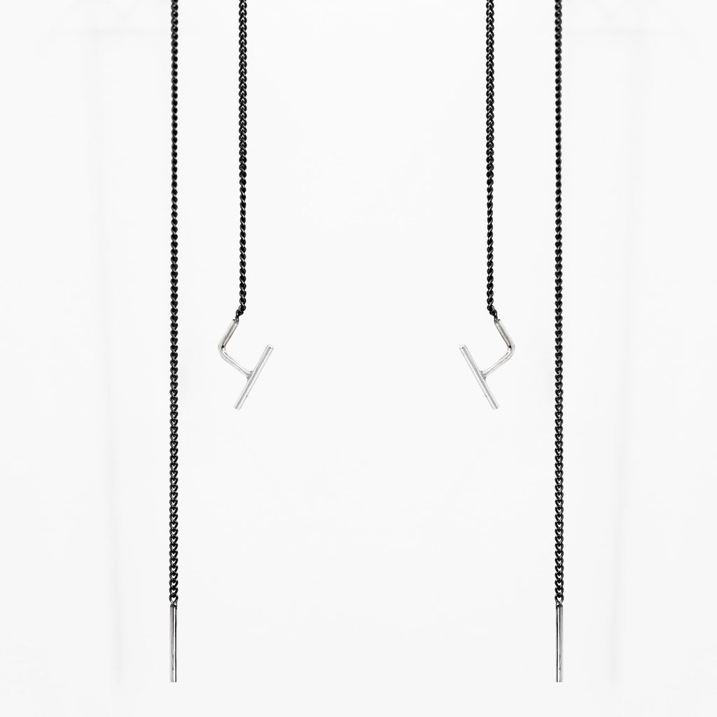 2. Studio image of Maarja Palu SWING 2 earrings with minimalist bar accents and oxidized silver chains