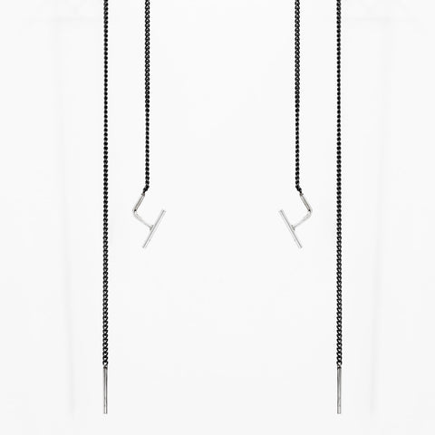 2. Studio image of Maarja Palu SWING 2 earrings with minimalist bar accents and oxidized silver chains