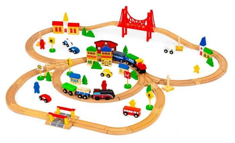 5. Overhead view of wooden train set with red bridge, houses, and vehicles