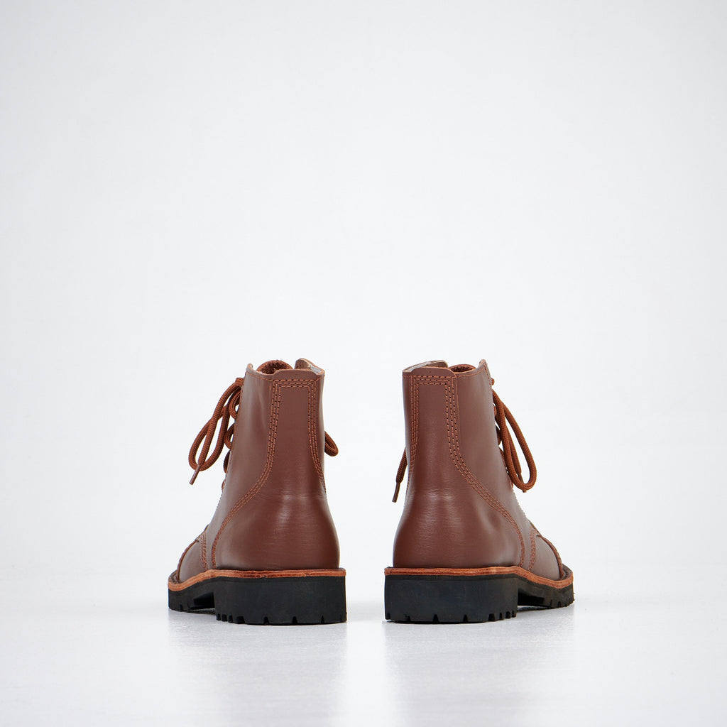 5. Back view of Aipi A-PS-2 brown leather boots, highlighting stitched rubber sole
