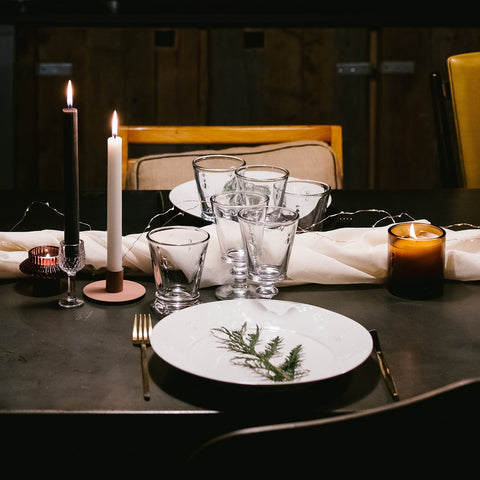 4. Elegant dining table setting with La Rochère Bee glasses, candles, and decorative plate