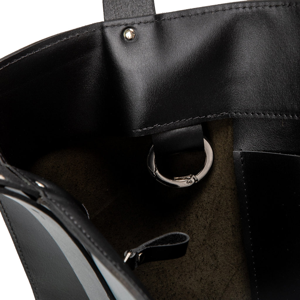 7. Interior view of PYKOK Adele handbag, highlighting carabiner and pocket details