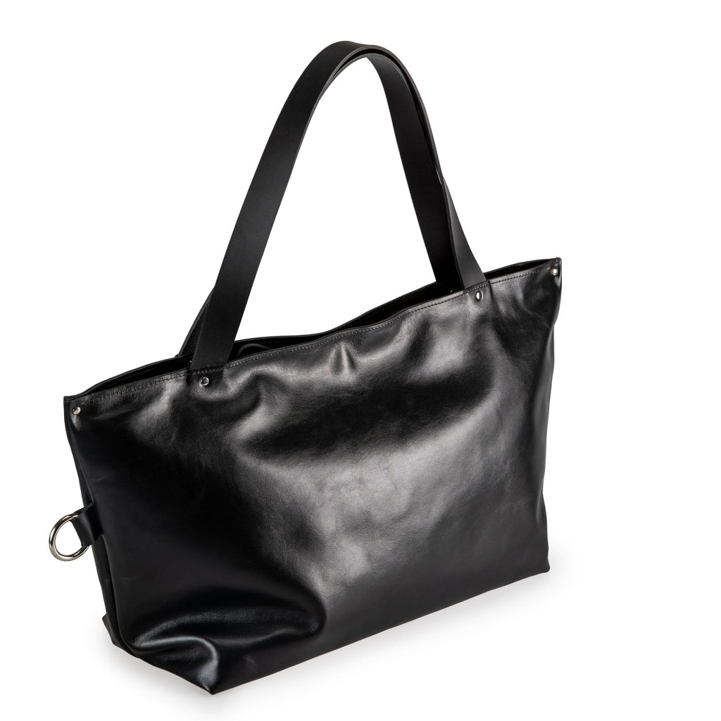 5. Studio shot of PYKOK Large Handbag Lima in soft black leather, showing front view and durable handles