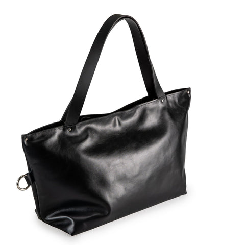 5. Studio shot of PYKOK Large Handbag Lima in soft black leather, showing front view and durable handles