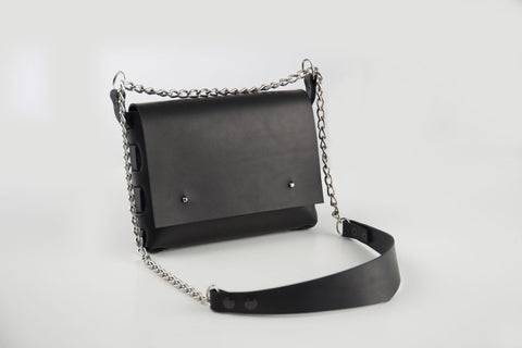4. Studio shot of PYKOK Agatha no.3 handbag with chain and leather strap, showcasing edgy rock style