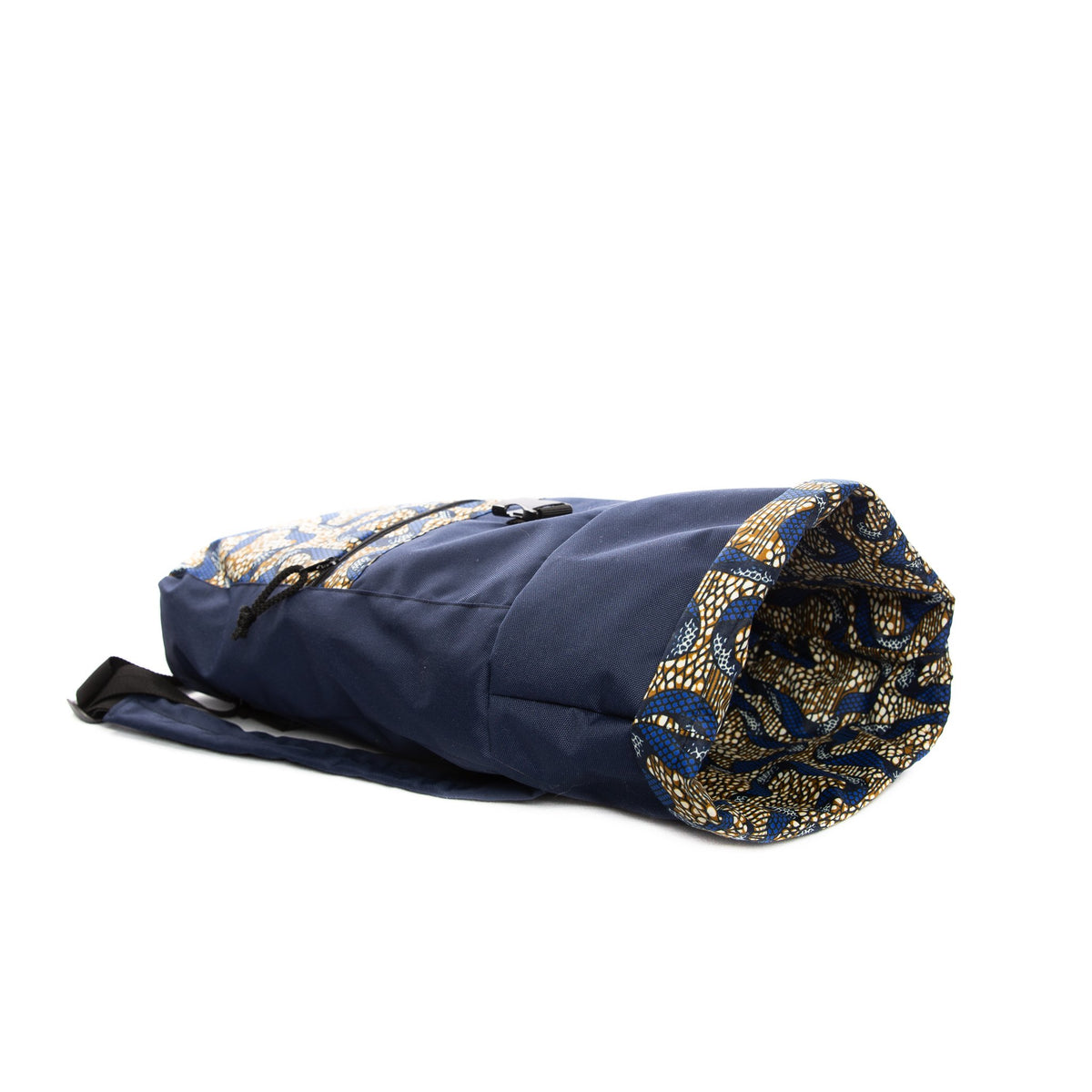 3. Side view of Drinbags ALIENS waterproof backpack in navy, showing roll-top design