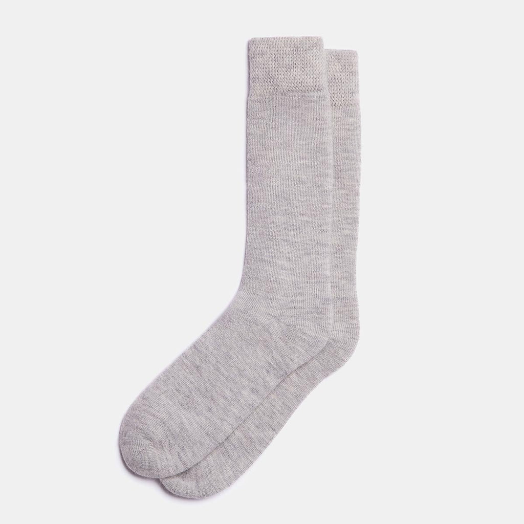 1. Unisex silver Alpaka natural alpaca wool socks in studio setting, showcasing fine knit and reinforced heel and toe
