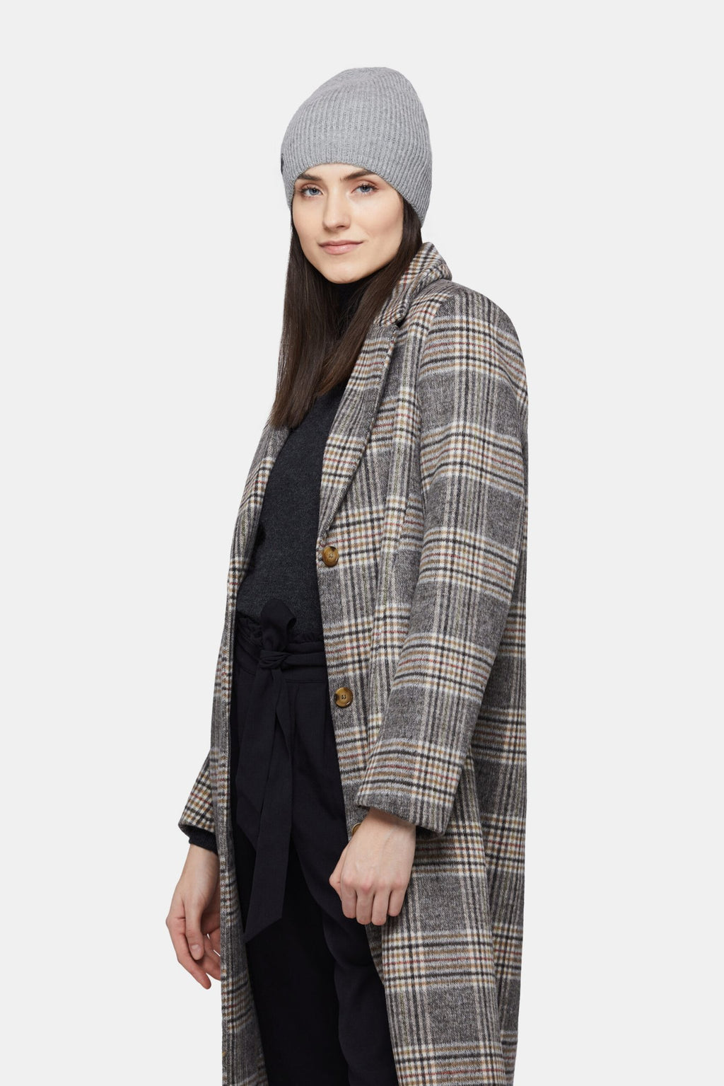 6. Woman wearing silver Alpaka baby alpaca wool fisherman's rib beanie with plaid coat, shown in side view