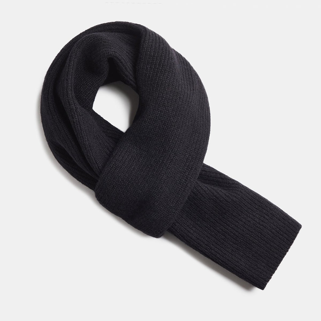 6. Flat lay of black Alpaka Fisherman's Rib scarf showing texture and design