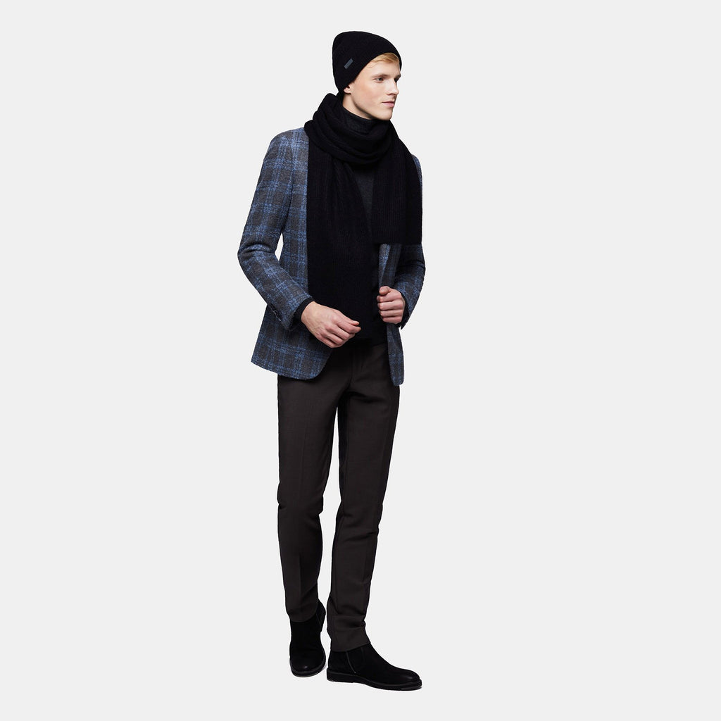 4. Men's black Alpaka Fisherman's Rib scarf and hat shown in side view with blazer