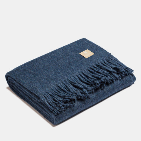 4. Navy Alpaka natural alpaca wool throw with fringe detail, folded in studio