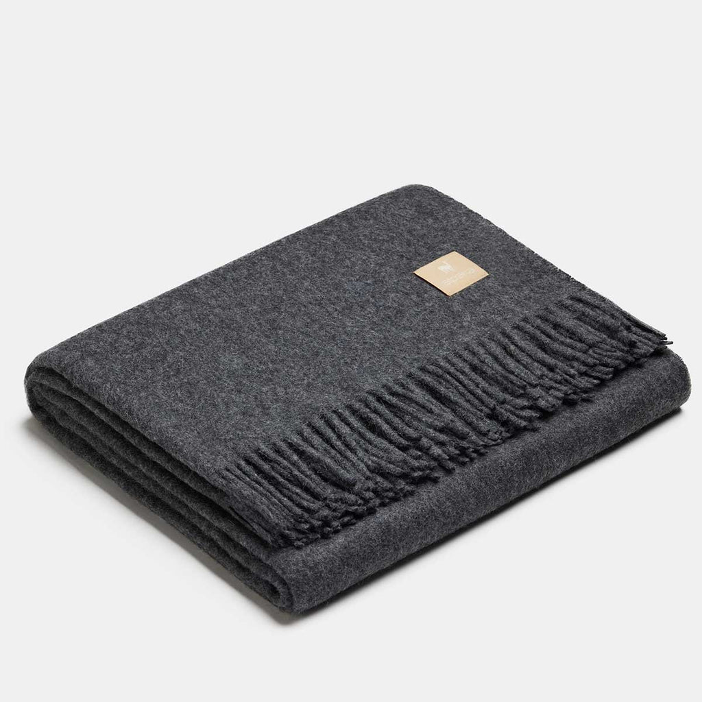 16. Silver Alpaka natural alpaca wool throw with fringe detail, folded in studio