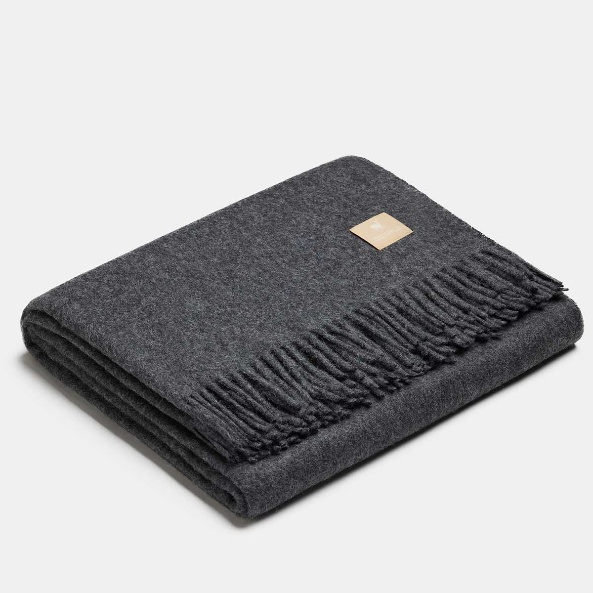 16. Silver Alpaka natural alpaca wool throw with fringe detail, folded in studio