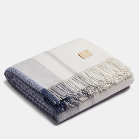 3. Folded Alpaka Natural Alpaca Wool Throw in Blue/Silver, showcasing fringe detail