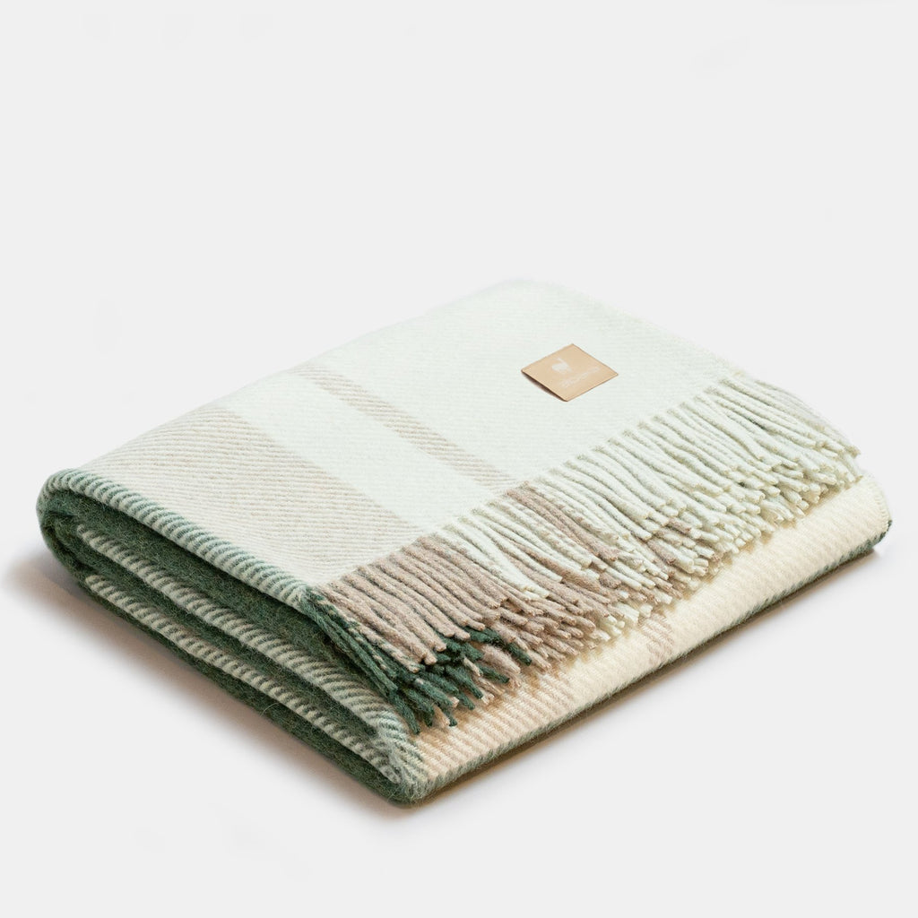 7. Folded Alpaka Natural Alpaca Wool Throw in Green/Beige, highlighting fringe and pattern