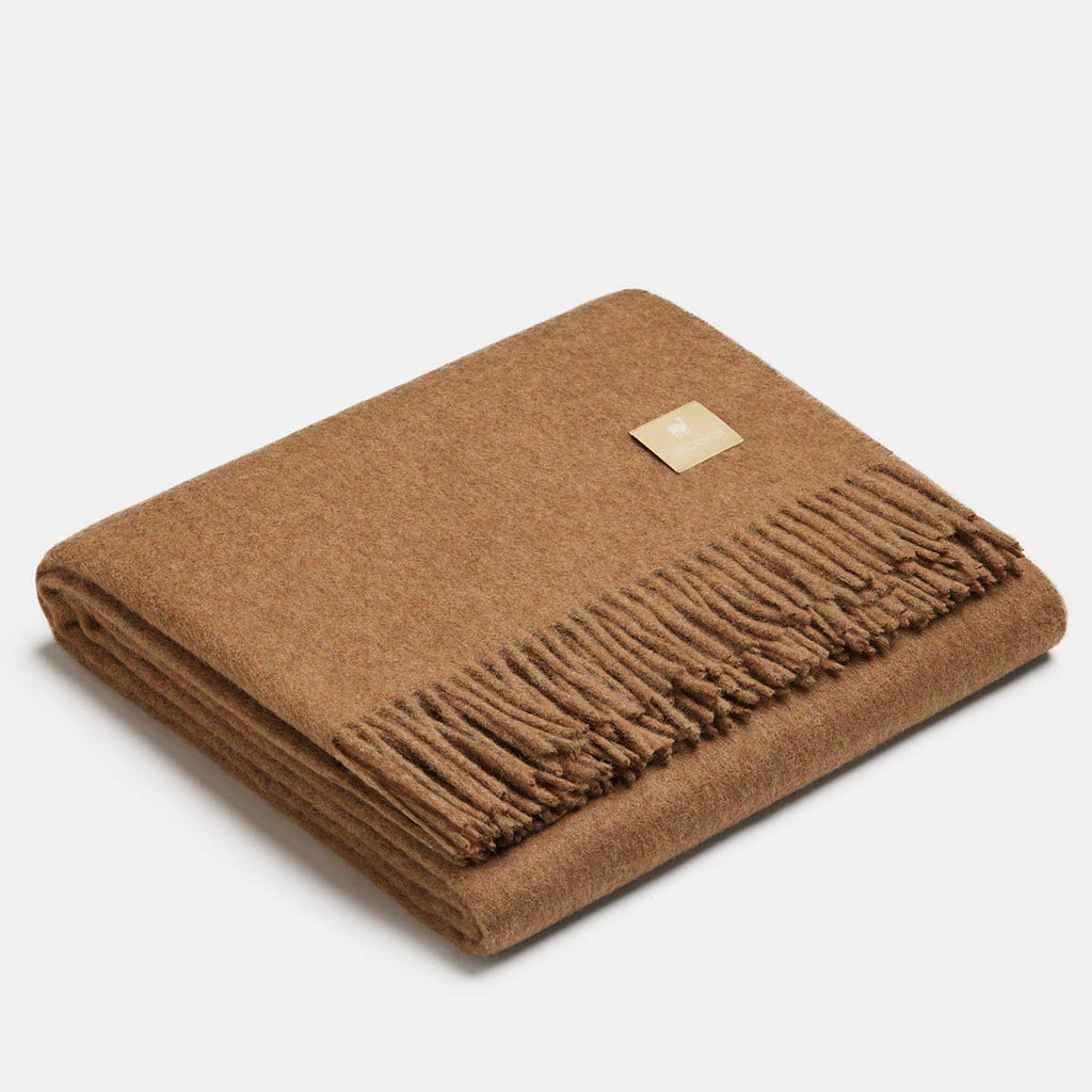 20. Milk coffee Alpaka natural alpaca wool throw with fringe detail, folded in studio