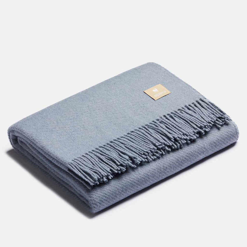 14. Charcoal-silver Alpaka natural alpaca wool throw with fringe detail, folded in studio