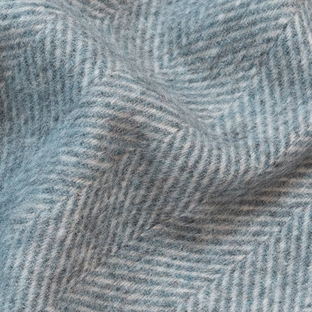 9. Close-up of blue Alpaka wool throw showing fishbone texture