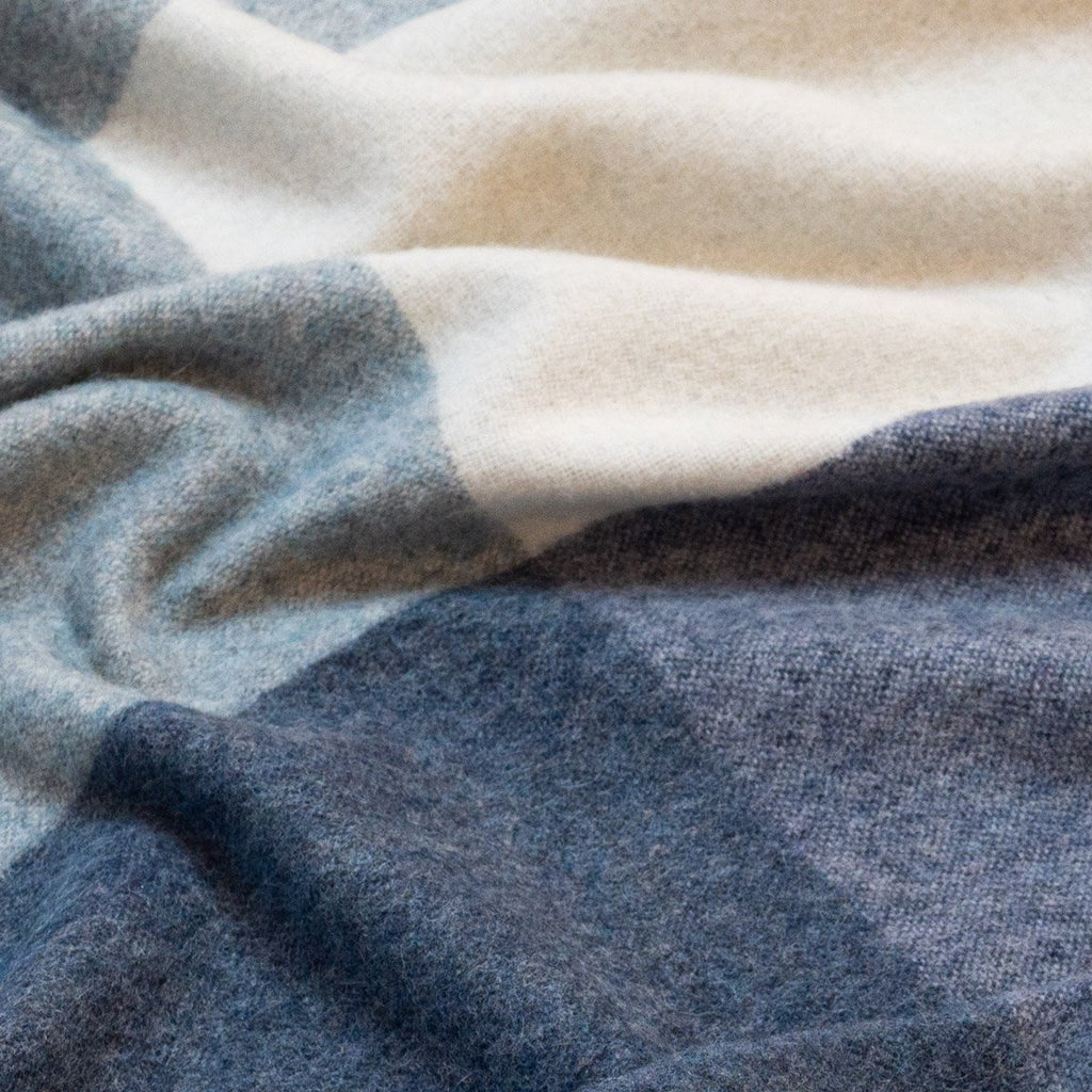 3. Close-up of blue Recycled Alpaca Wool Throw highlighting the soft check pattern and texture