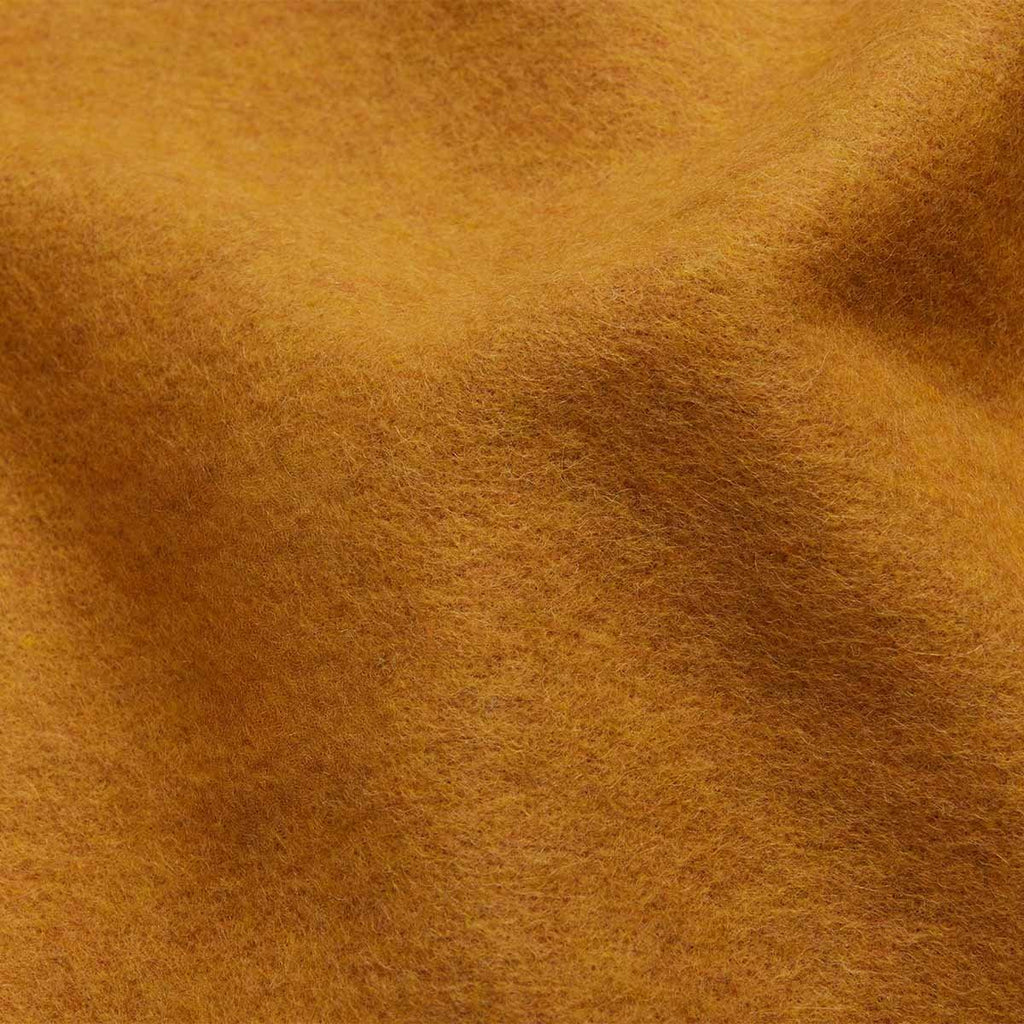 3. Close-up of mustard Alpaka natural alpaca wool fabric texture