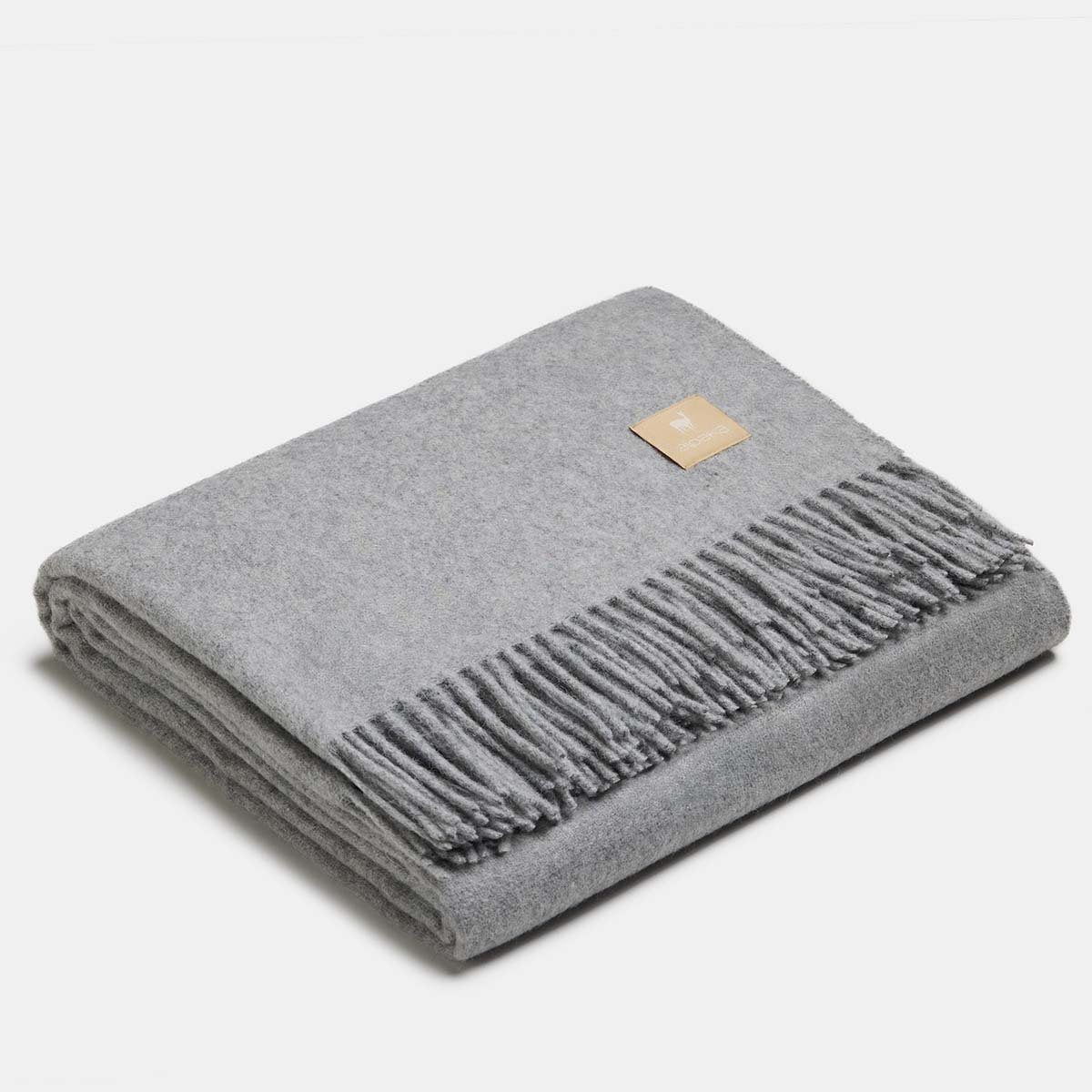 18. Dark cocoa Alpaka natural alpaca wool throw with fringe detail, folded in studio