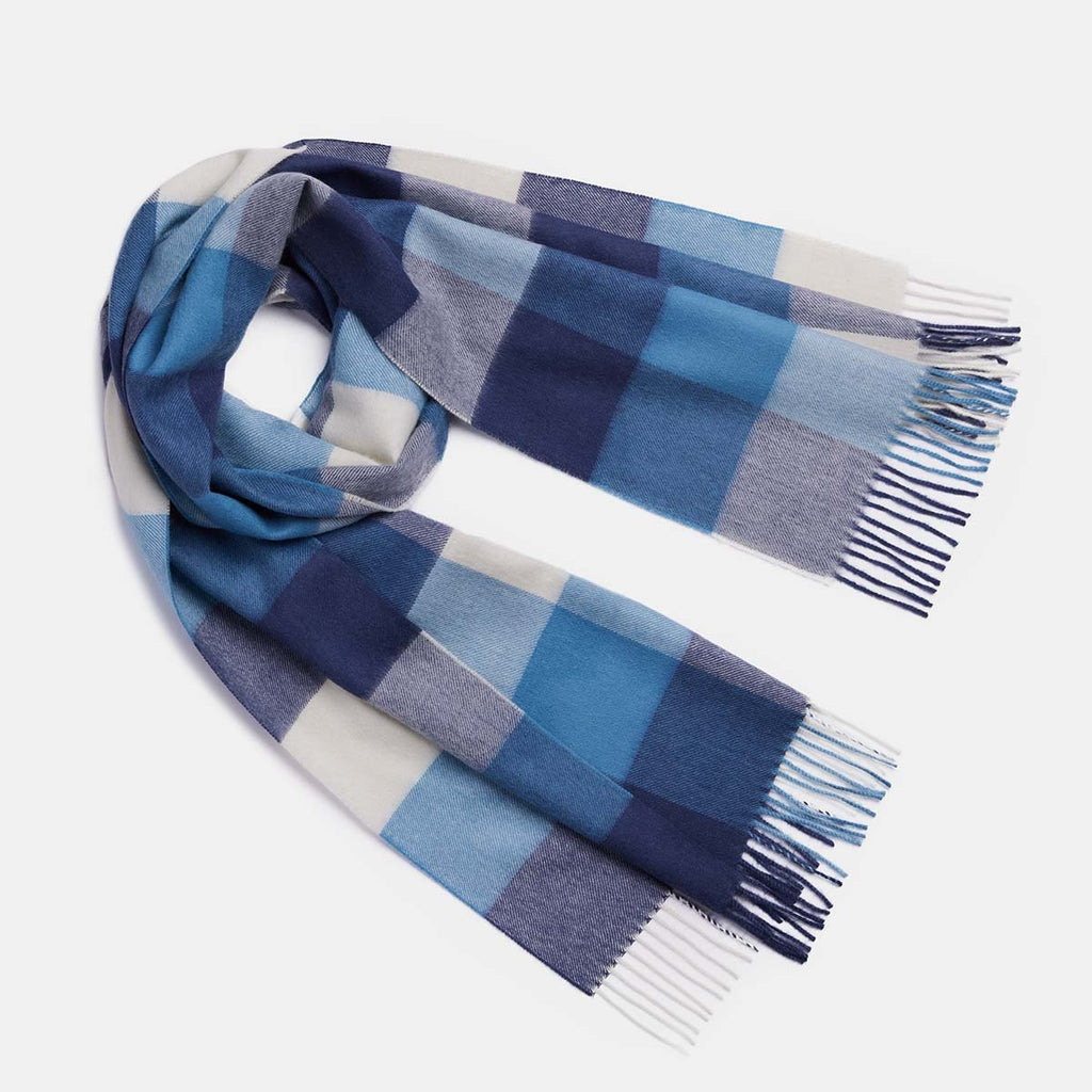 2. Women's natural baby alpaca wool check scarf in blue, shown in studio setting