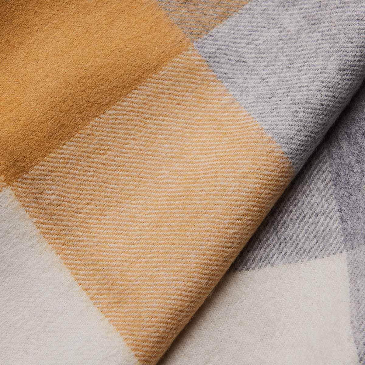 3. Close-up of gold and grey check pattern on women's baby alpaca wool scarf