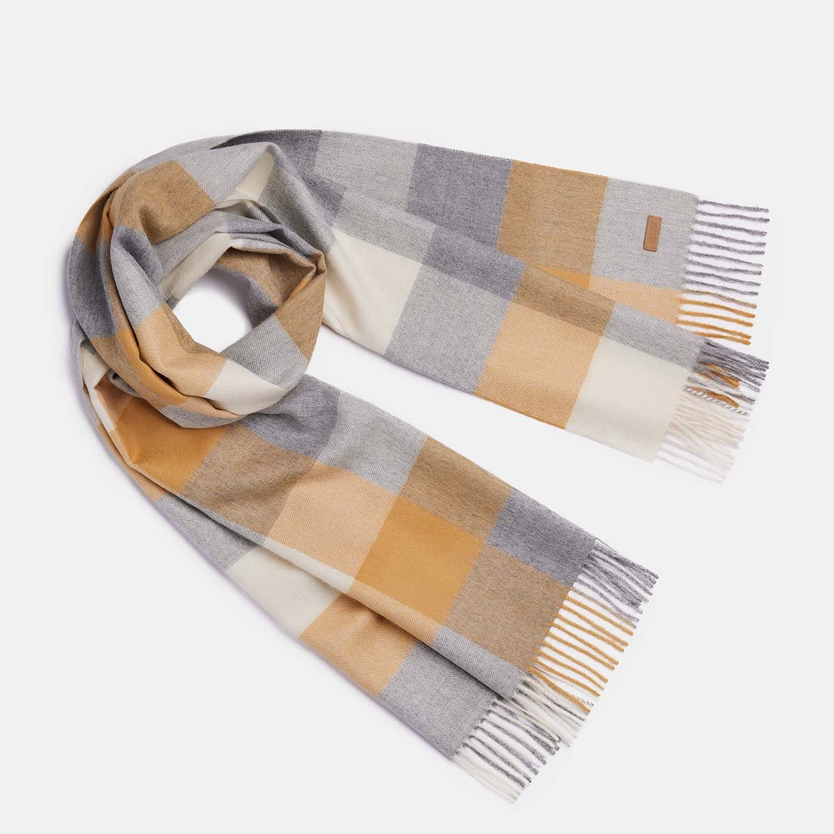 2. Women's natural baby alpaca wool check scarf in gold and grey, shown in studio setting
