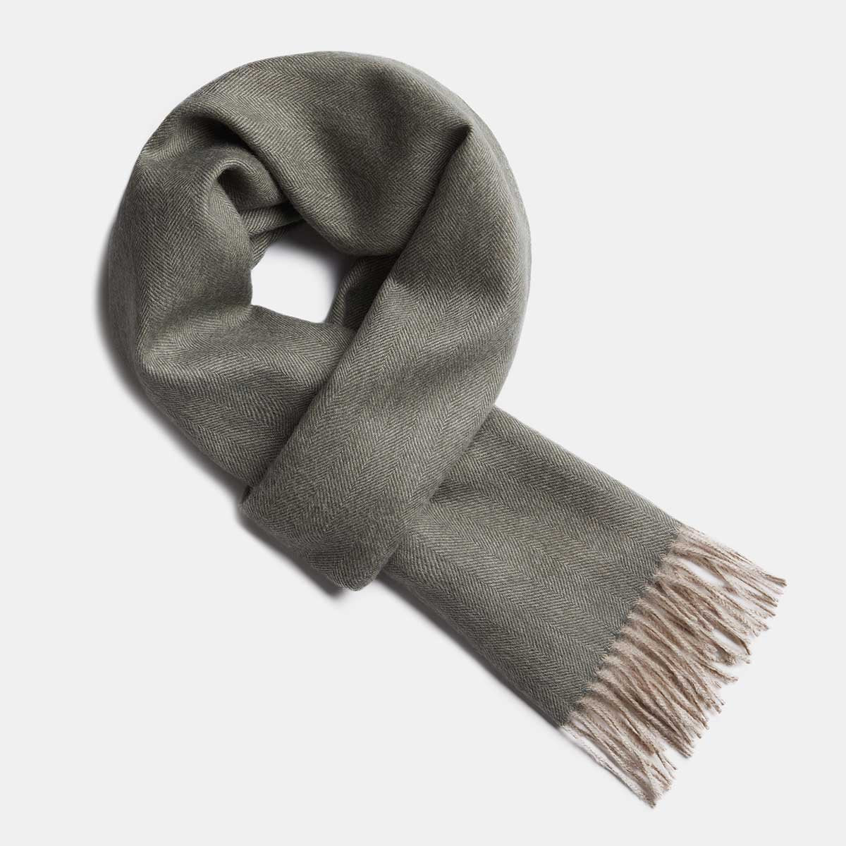 7. Studio image of Alpaka natural baby alpaca wool scarf in olive with fringe detail