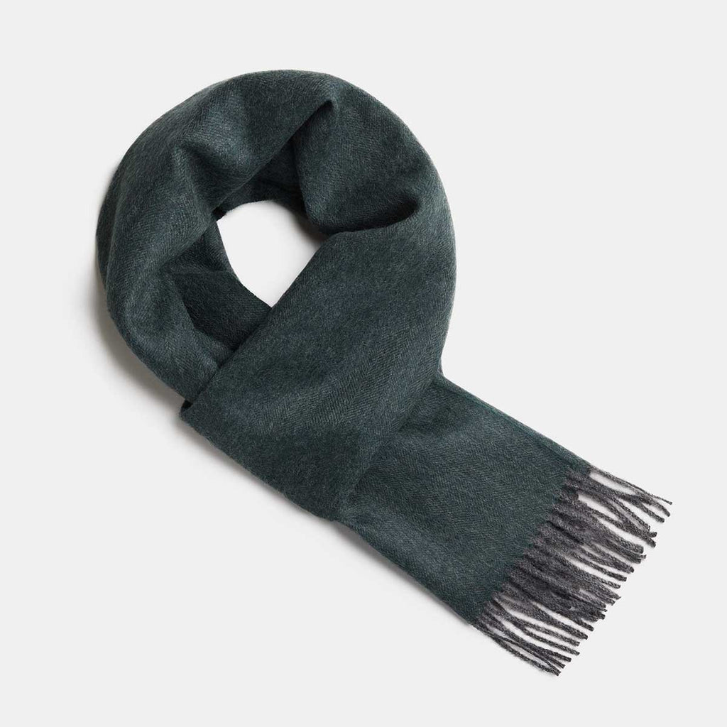 19. Studio image of Alpaka natural baby alpaca wool scarf in dark green with fringe detail