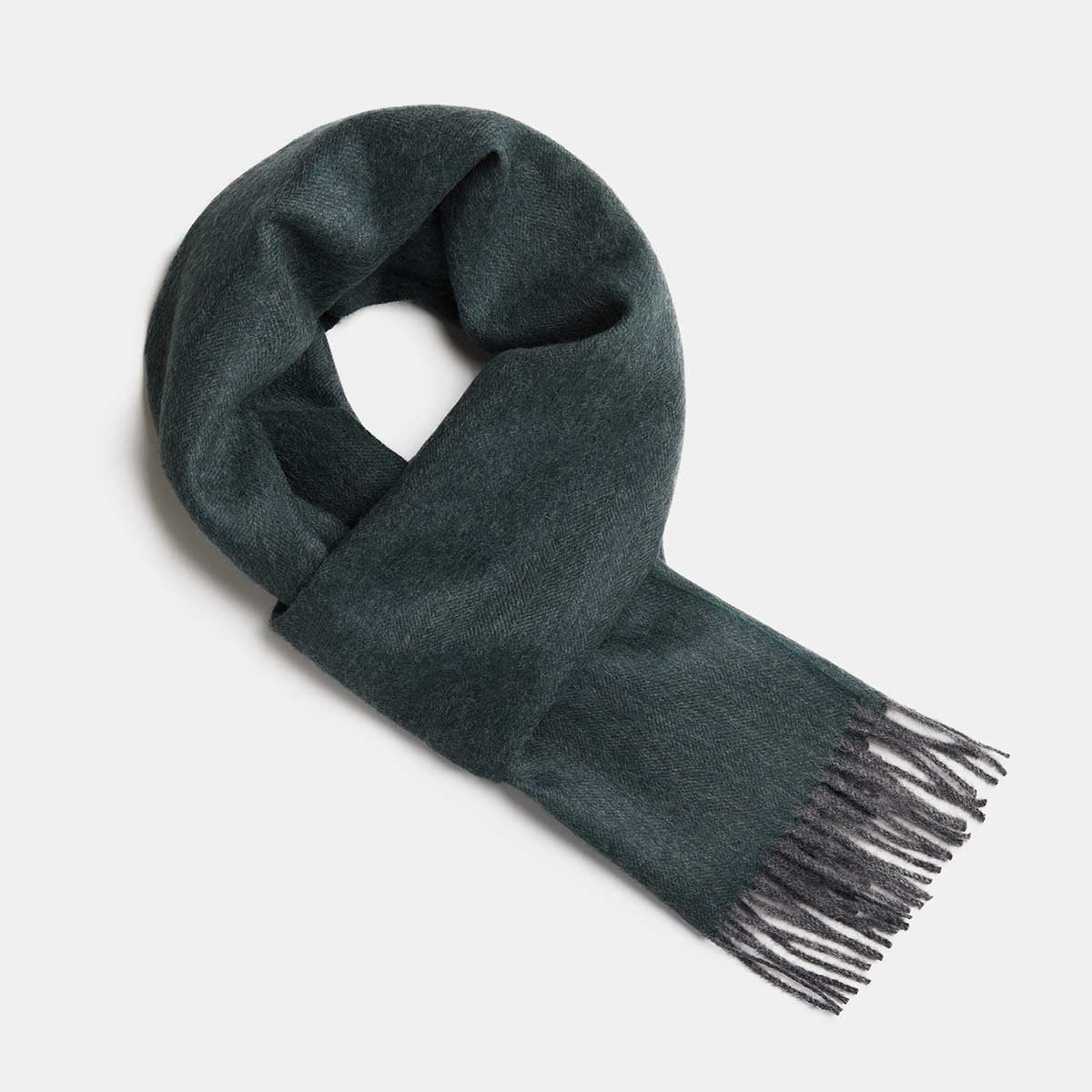 19. Studio image of Alpaka natural baby alpaca wool scarf in dark green with fringe detail