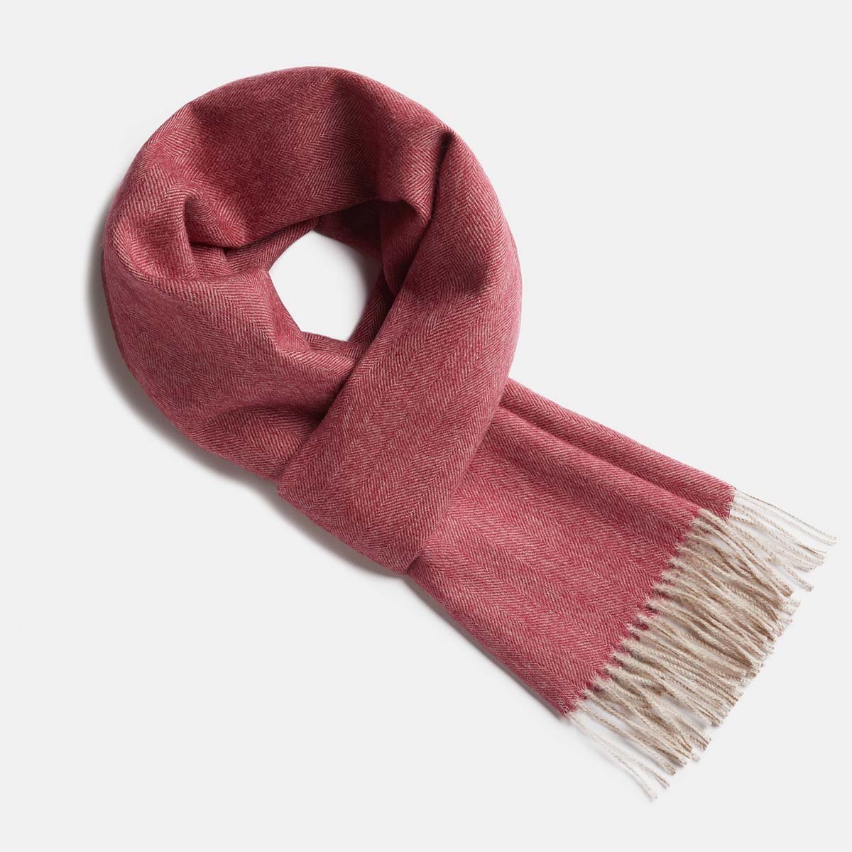 6. Studio image of Alpaka natural baby alpaca wool scarf in pink with fringe detail